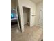 A simply designed toilet room adjacent to the main bathroom with tile flooring at 2655 Swooping Sparrow Dr, Harmony, FL 34773
