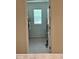 A view into an organized walk-in closet with natural light from a window at 2655 Swooping Sparrow Dr, Harmony, FL 34773