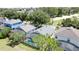 Aerial view of neighborhood homes featuring screened in pools and lush green landscaping at 2692 Hemingway Ave, Haines City, FL 33844