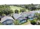 An elevated view of screened in pools and a golf course behind these lovely homes in a residential area at 2692 Hemingway Ave, Haines City, FL 33844