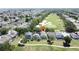 Community aerial view with golf course, serene neighborhood, and beautifully landscaped surroundings at 2692 Hemingway Ave, Haines City, FL 33844