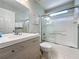 Bright bathroom with a combined shower and tub, paired with a contemporary vanity at 2692 Hemingway Ave, Haines City, FL 33844