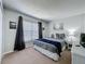 Comfortable bedroom features natural light, soft carpet and white wicker accents at 2692 Hemingway Ave, Haines City, FL 33844