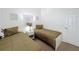 Inviting bedroom featuring twin beds, neutral wall decor, and soft carpet at 2692 Hemingway Ave, Haines City, FL 33844