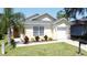 Charming single-story home featuring a well-maintained lawn and complemented by a neatly landscaped garden at 2692 Hemingway Ave, Haines City, FL 33844