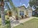 Inviting single-story home with a lush lawn, vibrant landscaping, and an attached one-car garage at 2692 Hemingway Ave, Haines City, FL 33844