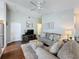 Comfortable living room featuring hardwood floors, plush seating, and a bright, airy atmosphere at 2692 Hemingway Ave, Haines City, FL 33844