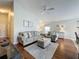 Cozy living room featuring comfortable seating, a ceiling fan, and neutral decor that provides a relaxing ambiance at 2692 Hemingway Ave, Haines City, FL 33844