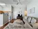 Inviting living area with an open-concept design, featuring hardwood floors and a neutral color palette at 2692 Hemingway Ave, Haines City, FL 33844