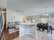 Inviting living space showcasing seamless flow between the living room, kitchen, and dining area at 2692 Hemingway Ave, Haines City, FL 33844