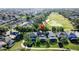 Community aerial view showcasing homes nestled amid lush landscaping, golf fairways, and a serene atmosphere at 2696 Hemingway Ave, Haines City, FL 33844