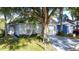 Charming single-story home with well-maintained lawn and mature trees providing shade and curb appeal at 2696 Hemingway Ave, Haines City, FL 33844