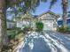 Charming single-story home featuring a well-manicured lawn, mature trees and an attached one car garage at 2696 Hemingway Ave, Haines City, FL 33844