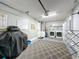 Garage area with laundry machines, grill, storage, and an epoxy sealed floor at 2696 Hemingway Ave, Haines City, FL 33844