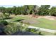 Picturesque golf course with mature trees and lush green grass at 2696 Hemingway Ave, Haines City, FL 33844