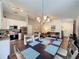 Open-concept kitchen and living area, featuring modern appliances, dining space, and comfortable seating at 2696 Hemingway Ave, Haines City, FL 33844