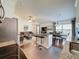 Open-concept living space with kitchen island, dining area, and comfortable seating at 2696 Hemingway Ave, Haines City, FL 33844