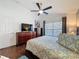 Spacious main bedroom with ceiling fan, hardwood floors, and natural light at 2696 Hemingway Ave, Haines City, FL 33844
