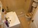 Functional bathroom featuring a shower with plastic shower curtain and neutral decor at 302 S Palm Ave, Frostproof, FL 33843