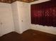 Bedroom features a closet, hardwood floors, decorative border, and white door at 302 S Palm Ave, Frostproof, FL 33843