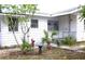 Charming home exterior with a quaint front yard and inviting entrance at 302 S Palm Ave, Frostproof, FL 33843