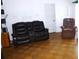 Spacious living room featuring neutral walls and parquet wood flooring at 302 S Palm Ave, Frostproof, FL 33843