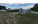 This home features a spacious backyard, storage shed, and mature trees, perfect for outdoor activities at 400 W 4Th Ct, Frostproof, FL 33843