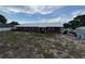 Brick home boasts large backyard with storage shed, providing ample space for gardening and recreation at 400 W 4Th Ct, Frostproof, FL 33843