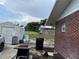 This home features a backyard with lawn, storage shed, and a fire pit, perfect for relaxing outdoors at 400 W 4Th Ct, Frostproof, FL 33843