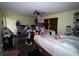 This bedroom includes a ceiling fan and a window and has space for sleeping and storage at 400 W 4Th Ct, Frostproof, FL 33843