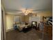 This primary bedroom features a ceiling fan and two windows, and offers space for relaxation at 400 W 4Th Ct, Frostproof, FL 33843