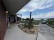 Property featuring a spacious driveway with a partial view of the serene lake at 400 W 4Th Ct, Frostproof, FL 33843