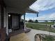 Charming front porch offering a picturesque view of the adjacent lake at 400 W 4Th Ct, Frostproof, FL 33843