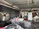 This garage boasts ample storage space and is equipped with shelving, rolling door, and fan at 400 W 4Th Ct, Frostproof, FL 33843