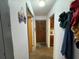 Hallway with a view to the front door and kitchen at 400 W 4Th Ct, Frostproof, FL 33843