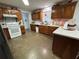 Functional kitchen with wood cabinets and modern appliances, ample space for cooking at 400 W 4Th Ct, Frostproof, FL 33843