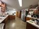 Spacious kitchen featuring wood cabinetry, modern appliances, and ample counter space at 400 W 4Th Ct, Frostproof, FL 33843