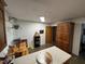 Bright kitchen with wood cabinetry, neutral countertops, and modern appliances at 400 W 4Th Ct, Frostproof, FL 33843