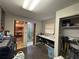A utility-filled laundry room with washer, dryer, sink, and adjacent shower at 400 W 4Th Ct, Frostproof, FL 33843