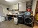 Laundry room featuring modern washer and dryer at 400 W 4Th Ct, Frostproof, FL 33843