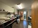 Spacious laundry room with washer, dryer, shelving, and adjacent shower at 400 W 4Th Ct, Frostproof, FL 33843