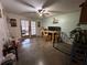 Multi-purpose living room with direct access to an outdoor area through glass paneled doors at 400 W 4Th Ct, Frostproof, FL 33843