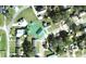 Aerial view of property featuring private yard with mature trees at 405 S Shore Dr, Eagle Lake, FL 33839