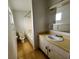 Functional bathroom with a tub, vanity, and neutral finishes at 405 S Shore Dr, Eagle Lake, FL 33839