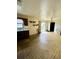 Open-concept kitchen/dining area provides a spacious flow and access to the backyard at 405 S Shore Dr, Eagle Lake, FL 33839