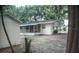 Rear view of the home highlighting the back porch area and adjacent storage shed at 4725 Kayworth Rd, Lake Wales, FL 33898