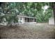 A charming home featuring a screened-in porch and spacious backyard surrounded by mature trees at 4725 Kayworth Rd, Lake Wales, FL 33898