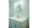 Bright bathroom with a clean, white vanity and a well-lit mirror at 4725 Kayworth Rd, Lake Wales, FL 33898