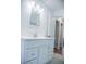 Bathroom featuring a white vanity, decorative mirror and a light fixture at 4725 Kayworth Rd, Lake Wales, FL 33898