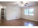 Light-filled bedroom with wood floors, closet, and large window at 4725 Kayworth Rd, Lake Wales, FL 33898